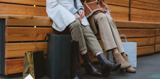 two women sitting after shopping
