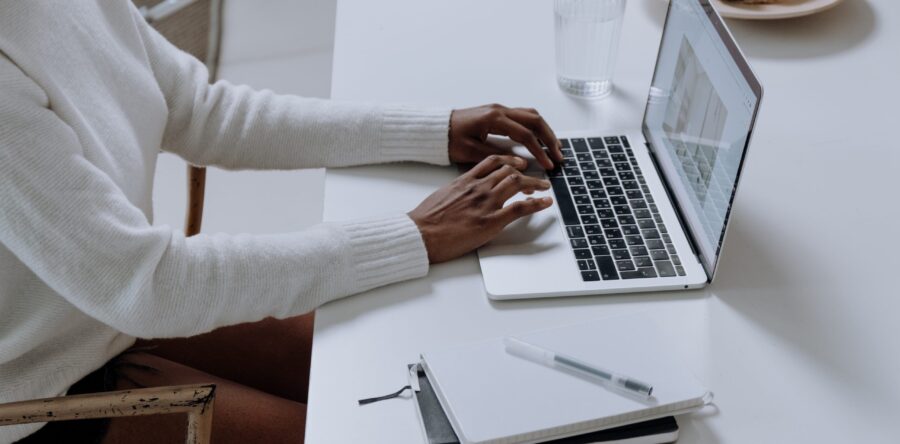 Woman working at a desk on her laptop