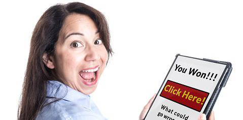 Woman looking excited at a scam on a ipad