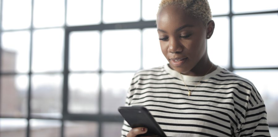 Woman looking down at her phone