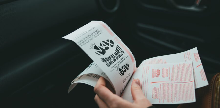 Someone Holding multiple lottery tickets